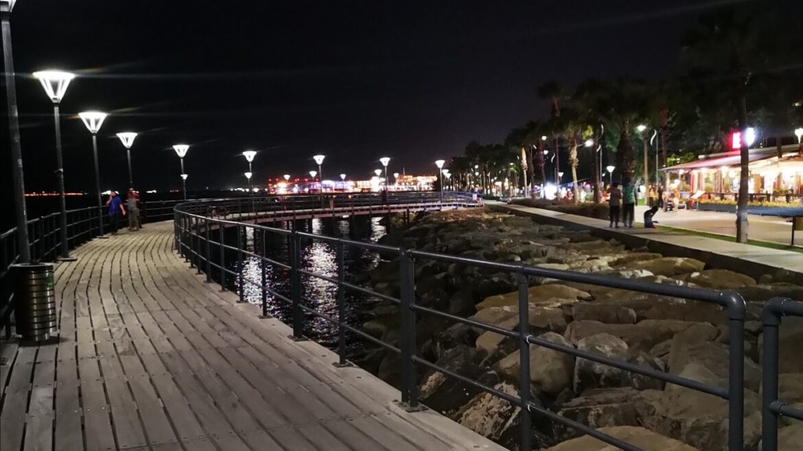 walking on molos promenade at night