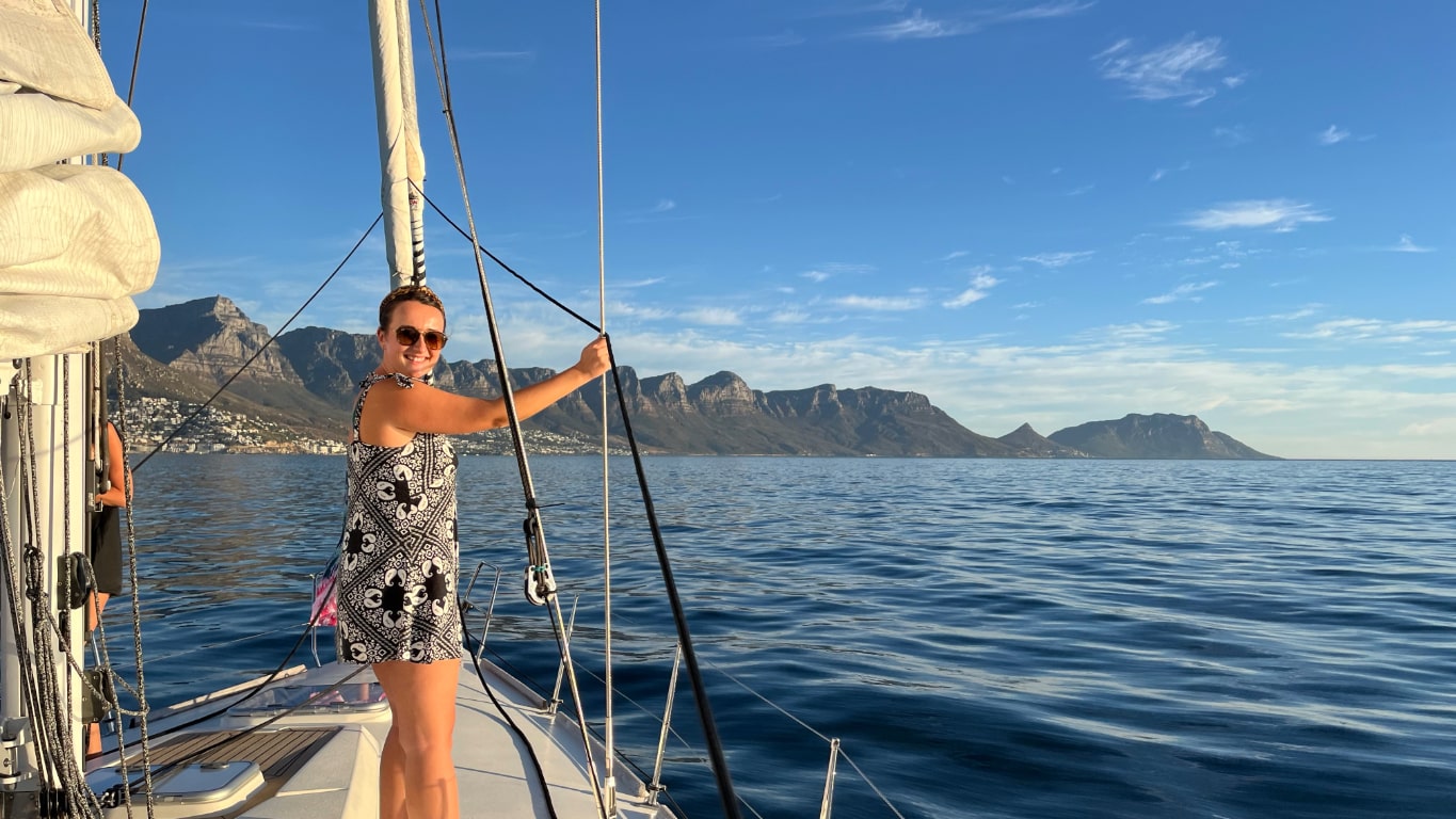 Meg on a sailing boat with Table Mountain in the background