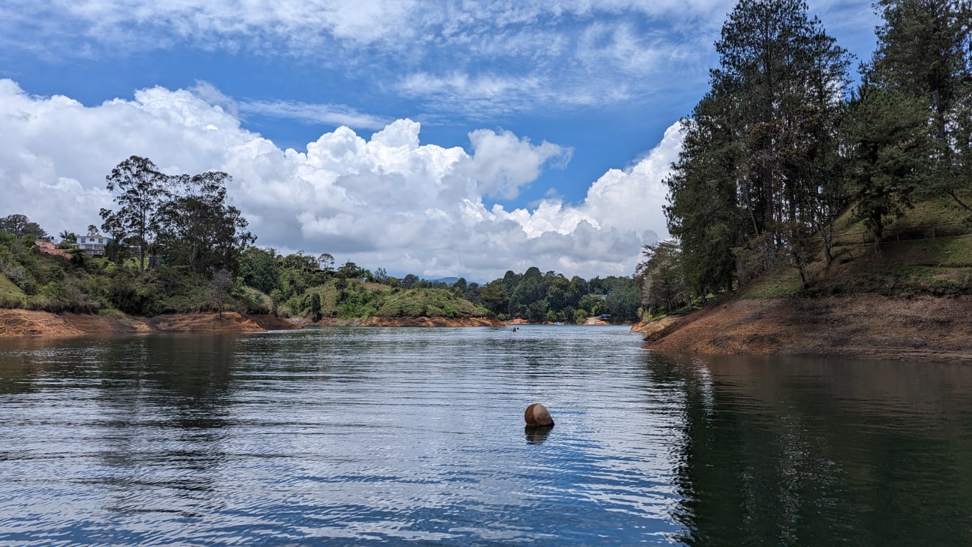 View over the take with cloud reflecting in the water at Guatape Colombia