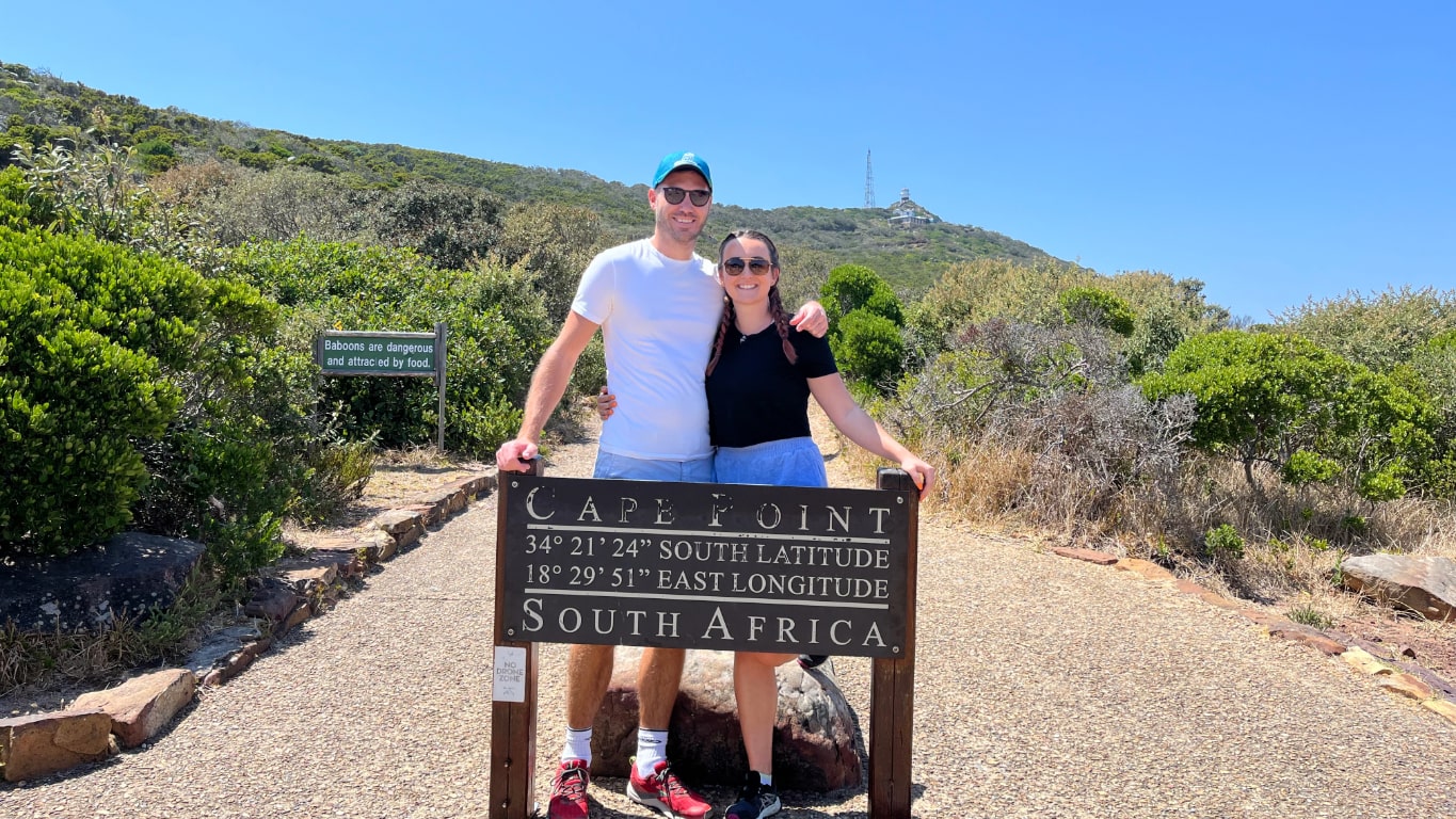 Meg and Aaron standing by the Cape Point sign in Cape Town South Africa