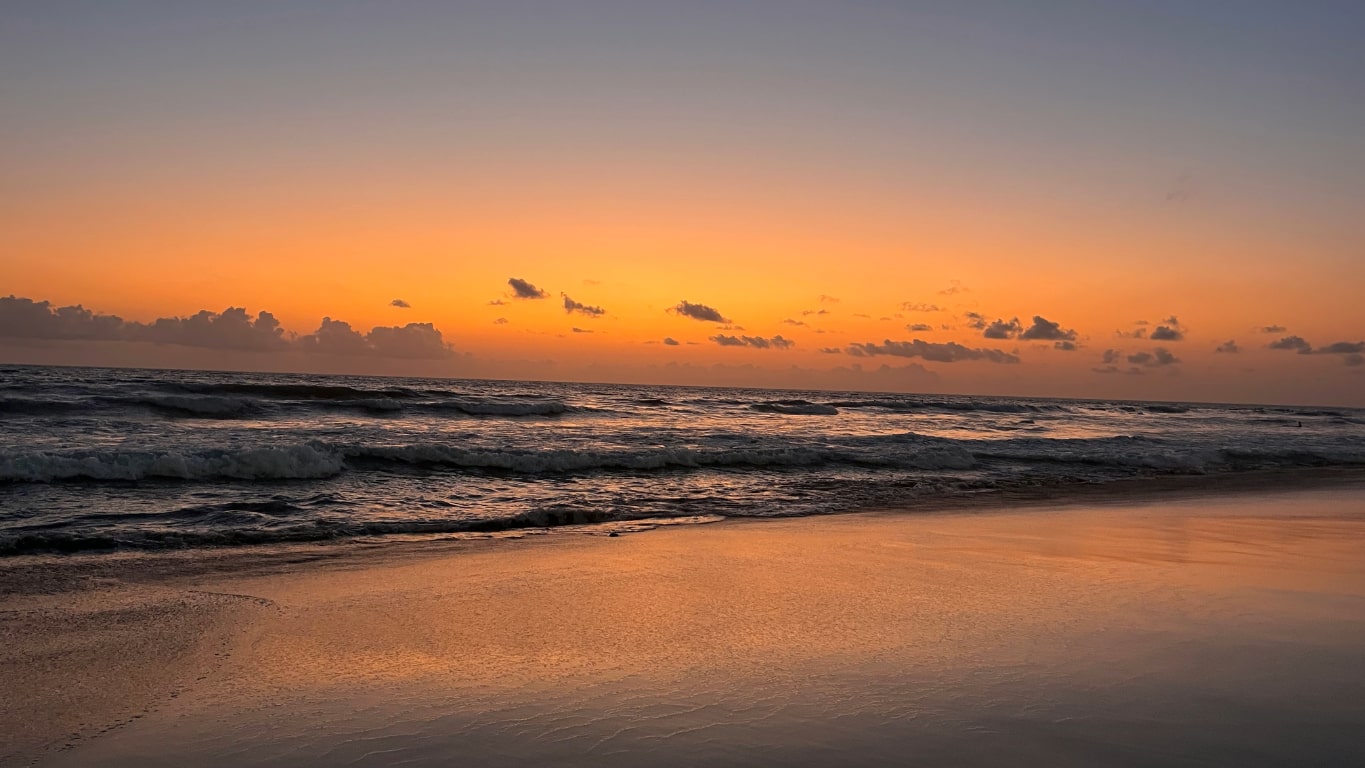 Orange sunset over the sea at Echo Beach, Canggu Bali